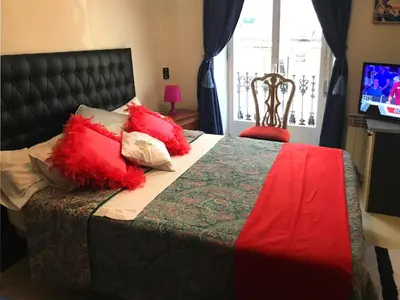 Cama o camas de una habitación en CATEDRAL IMPERIAL Central