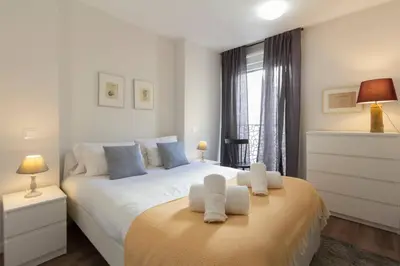 Cama o camas de una habitación en MUN Stays Gran Vía III