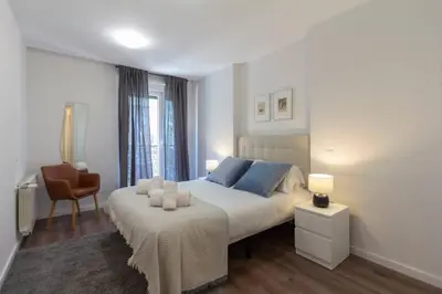 Cama o camas de una habitación en MUN Stays Gran Vía III