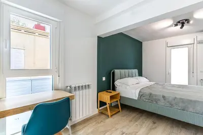Cama o camas de una habitación en Tu casa con terraza en Madrid