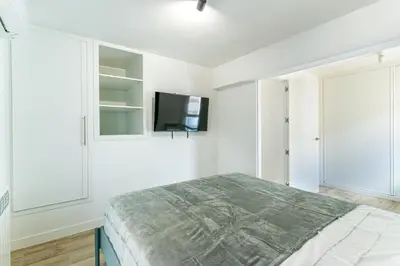 Cama o camas de una habitación en Tu casa con terraza en Madrid
