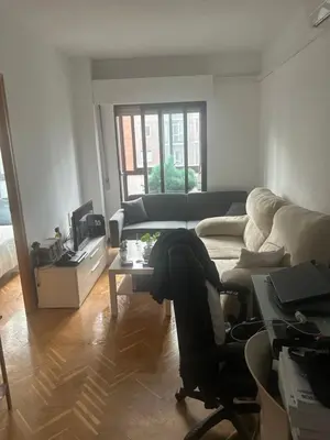 Zona de estar de Madrid Retiro Room
