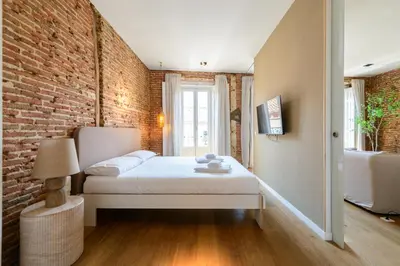 Cama o camas de una habitación en Waou Chueca V - Alquiler Corta Duración