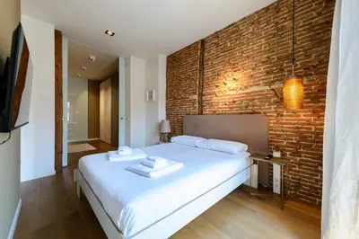 Cama o camas de una habitación en Waou Chueca V - Alquiler Corta Duración