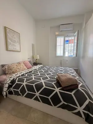 Cama o camas de una habitación en Moderno espectacular hogar en Puerta del Ángel