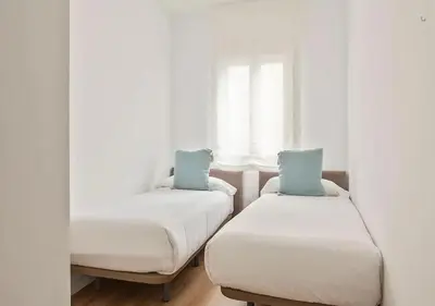 Cama o camas de una habitación en Apartamentos Gran Vía