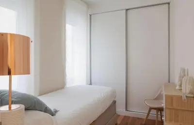 Cama o camas de una habitación en Apartamentos Gran Vía