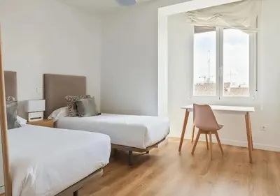 Cama o camas de una habitación en Apartamentos Gran Vía