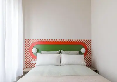 Cama o camas de una habitación en Cozy apartment—Color and comfort in Malasaña
