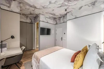 Cama o camas de una habitación en ColivINN Plaza Mayor
