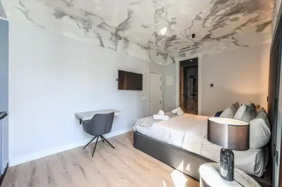 Cama o camas de una habitación en ColivINN Plaza Mayor