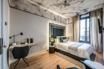 Cama o camas de una habitación en AmazINN Collection Madrid Plaza Mayor