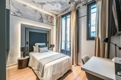 Cama o camas de una habitación en AmazINN Collection Madrid Plaza Mayor