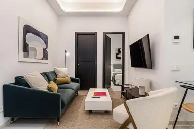 Una televisión o centro de entretenimiento en Waou Urban Home Salamanca II