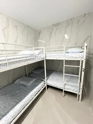 Cama o camas de una habitación en Hostel JIRAFA