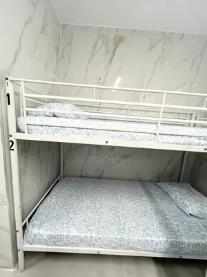 Cama o camas de una habitación en Hostel JIRAFA