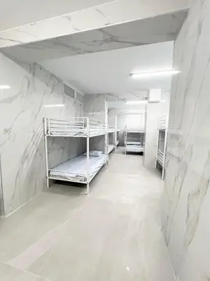 Cama o camas de una habitación en Hostel JIRAFA