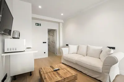 Una televisión o centro de entretenimiento en Carretas Suites