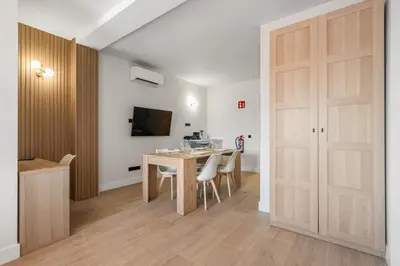 Una televisión o centro de entretenimiento en Carretas Suites