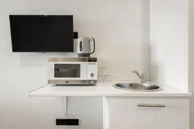 Una cocina o zona de cocina en Carretas Suites