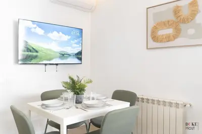 Una televisión o centro de entretenimiento en Argüelles Apartments
