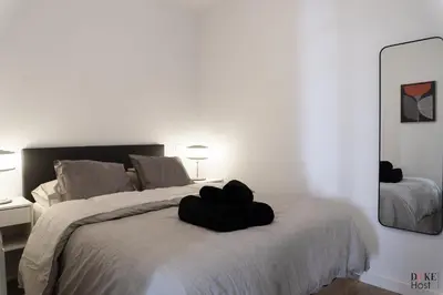 Cama o camas de una habitación en Argüelles Apartments