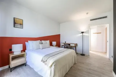 Cama o camas de una habitación en AmazINN Madrid Atocha