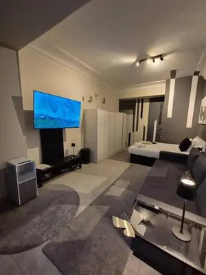 Una televisión o centro de entretenimiento en Habitación Oasis F. centro de Madrid!