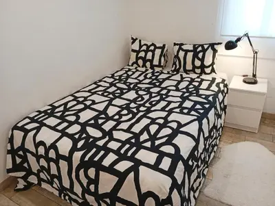Cama o camas de una habitación en Apartamento a una parada de Atocha