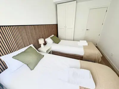 Cama o camas de una habitación en Retiro Residence esmeralda