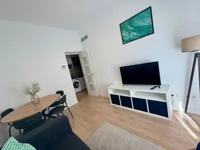 Una televisión o centro de entretenimiento en Retiro Residence esmeralda