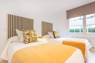 Cama o camas de una habitación en Estilo y Confort en el Corazón de Salamanca