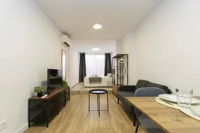Una televisión o centro de entretenimiento en Regency IV - Ferga Suites