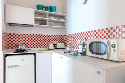 Una cocina o zona de cocina en Apartamento para 9 personas en Malasaña