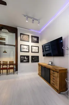 Una televisión o centro de entretenimiento en PDA2BI Loft de lujo, de diseño, histórico, a estrenar! Temporal