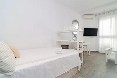 Cama o camas de una habitación en Fantástico Loft en el Entorno Urbano