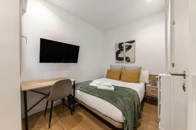 Cama o camas de una habitación en Waou Urban Home Goya - Corta Duración
