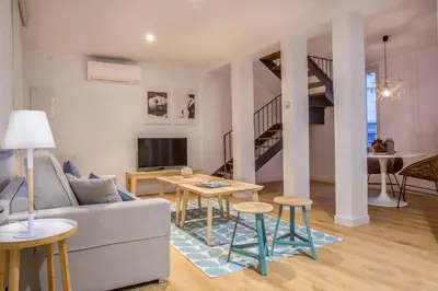 Zona de estar de Slow Suites Luchana