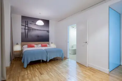 Cama o camas de una habitación en Slow Suites Luchana