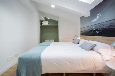 Cama o camas de una habitación en Slow Suites Luchana