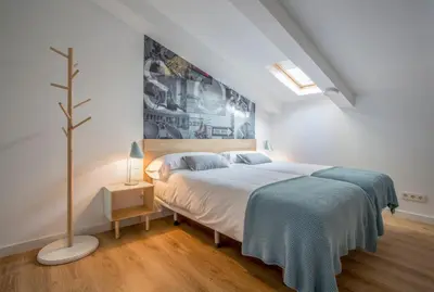 Cama o camas de una habitación en Slow Suites Luchana