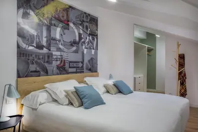Cama o camas de una habitación en Slow Suites Luchana