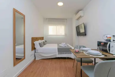 Una televisión o centro de entretenimiento en Classy XV - Ferga Suites
