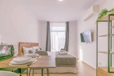 Una televisión o centro de entretenimiento en Deluxe XII - Ferga Suites
