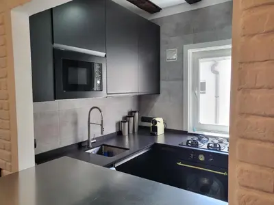 Una cocina o zona de cocina en Lovely Loft Apartment Madrid Center
