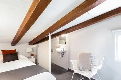 Cama o camas de una habitación en Carretas Attics Apartments