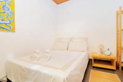 Cama o camas de una habitación en Raíces íntimas en La Latina