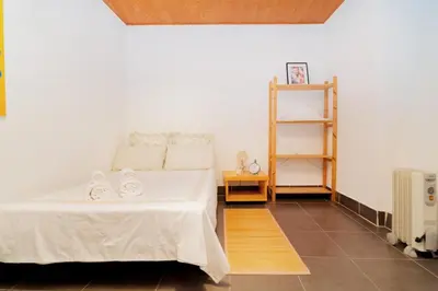 Cama o camas de una habitación en Raíces íntimas en La Latina