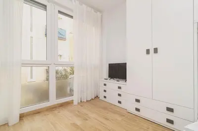 Una televisión o centro de entretenimiento en Refugio Luminoso Junto a Gran Vía