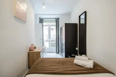 Cama o camas de una habitación en Mi apartamento en Lavapiés